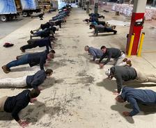 Dry Pro Foundation and Crawlspace Specialists employees complete push-up challenge for Pediatric Cancer.