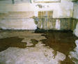 Basement walls with water leaking through cracks