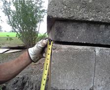 Certified Field Inspector Inspecting Exterior Gap in Bricks