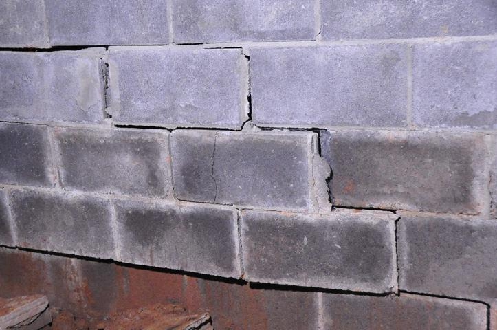 broken basement wall with stairstep crack
