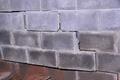 broken basement wall with stairstep crack