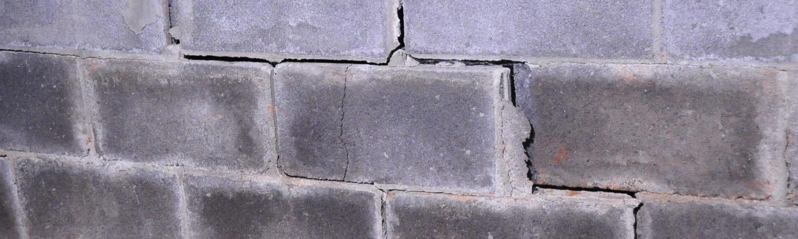 broken basement wall with stairstep crack