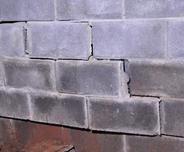 broken basement wall with stairstep crack