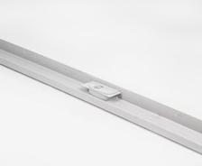 A long, silver metal track with a small square component mounted in the center, against a white background.