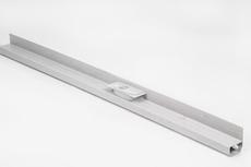 A long, silver metal track with a small square component mounted in the center, against a white background.