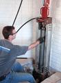 technician installing advanced steel push piers