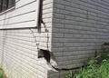 Severely cracked foundation on the exterior of the home