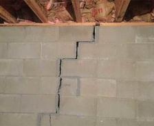 very bad crack in cement basement wall that is separating and threatening the structure of the home
