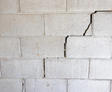 Cinder block wall with stair step cracks