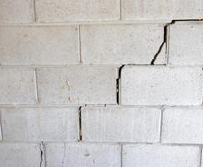 Cinder block wall with stair step cracks