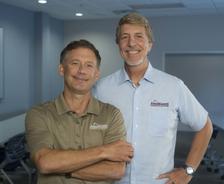 Two men standing in a room