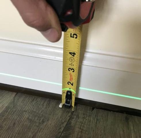 unlevel floors measured by laser and tape measurer
