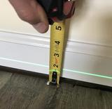 unlevel floors measured by laser and tape measurer