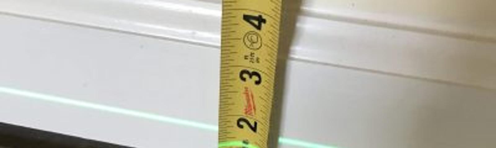 unlevel floors measured by laser and tape measurer