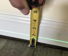 unlevel floors measured by laser and tape measurer