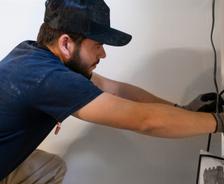AquaGuard technician performing basement waterproofing