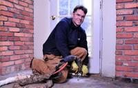 Man injecting PolyRenewal into concrete