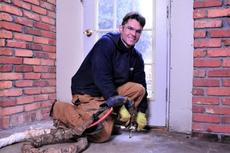 Man injecting PolyRenewal into concrete