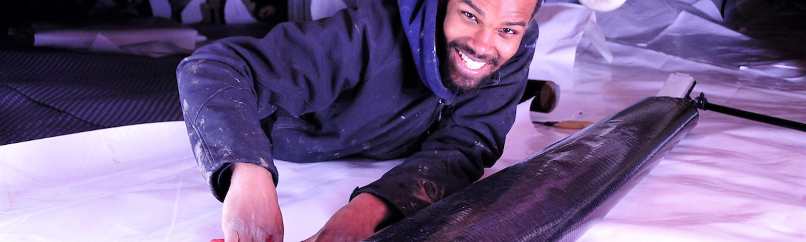 Man installing CrawlSeal Crawl Space Vapor Barrier