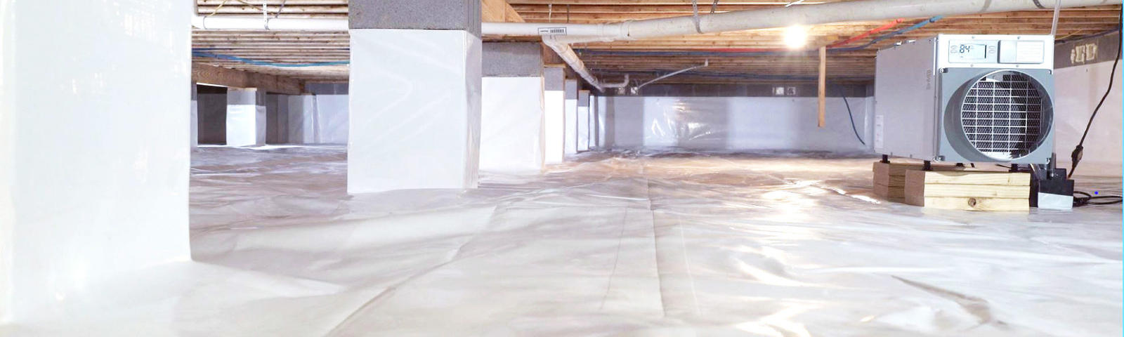 Finished encapsulated crawlspace with a dehumidifier