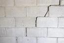 Cinder block wall with stair step cracks