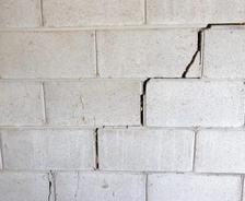Cinder block wall with stair step cracks