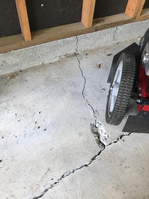 Y shaped crack on concrete garage floor