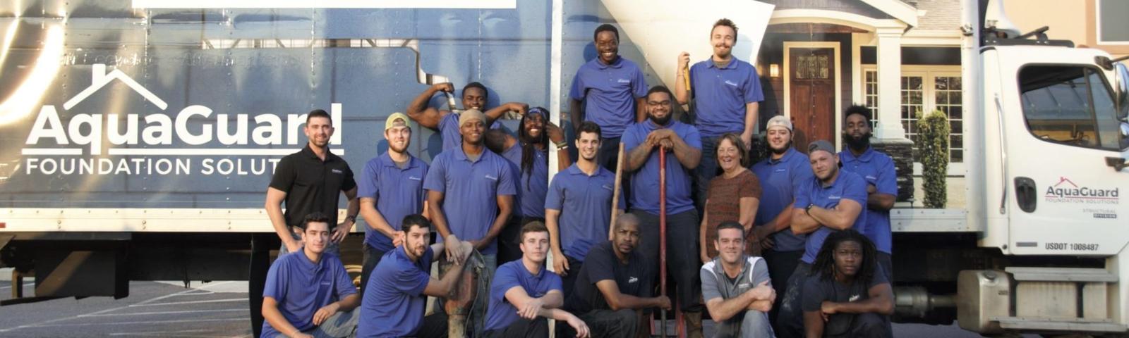 Aquaguard team standing in front of Aquaguard box truck