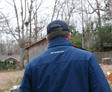 Back of man in Groundwork jacket and hat