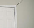 interior drywall crack in beige wall near closetdoorframe