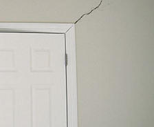 interior drywall crack in beige wall near closetdoorframe