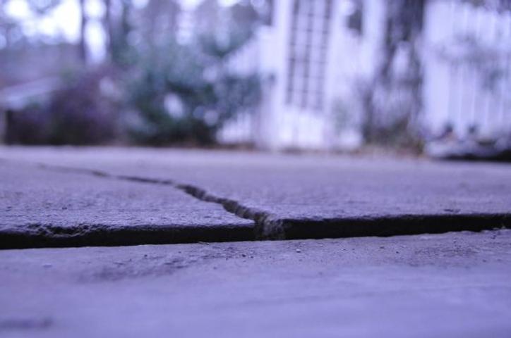 Sunken concrete garage slab with crack