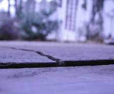Sunken concrete garage slab with crack