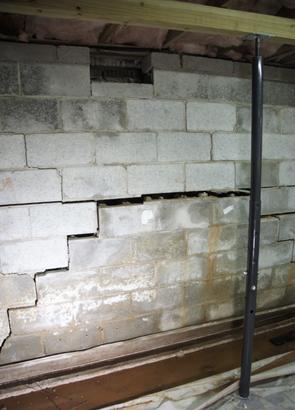 Bowing basement wall with stair step cracks