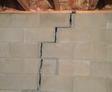 very bad crack in cement basement wall that is separating and threatening the structure of the home