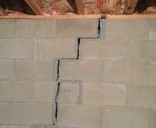 very bad crack in cement basement wall that is separating and threatening the structure of the home