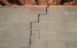 very bad crack in cement basement wall that is separating and threatening the structure of the home
