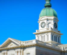 A photo of the clock tower of the city hall building in Athens, Georgia.