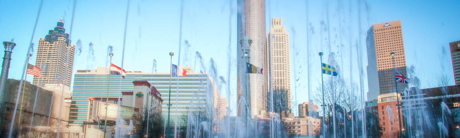 A photo of downtown Atlanta seen through fountains
