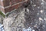 Soil Erosion against brick house