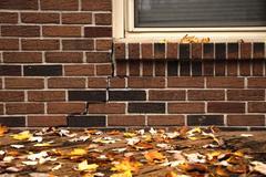 exterior crack in brick from foundation settlement and erosion