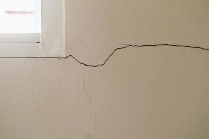 horizontal crack stemming from corner of windowsill