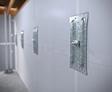 Basement wall anchors mounted in a newly waterproofed basement