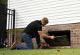 A certified Field inspection performing a crawl space inspection near on open crawl space vent
