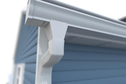 White gutters with downspout on a blue house
