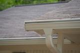 White gutters on the corner of a house