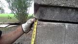 Certified Field Inspector Inspecting Exterior Gap in Bricks