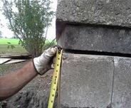 Certified Field Inspector Inspecting Exterior Gap in Bricks