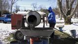 worker mixing fresh concrete