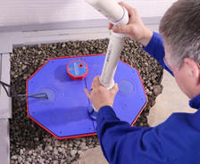 aquaguard service tech installing new sump pump
